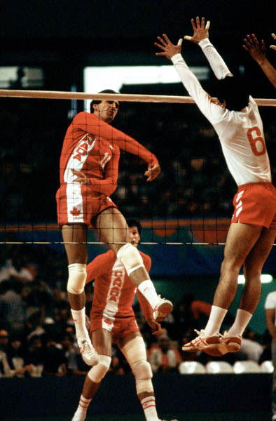 Canada's Garth Pischke (left) and Al Coulter (behind) compete in the men's volleyball event at the 1984 Los Angeles Summer Olympic Games. (CP PHOTO/COA/Scott Grant)