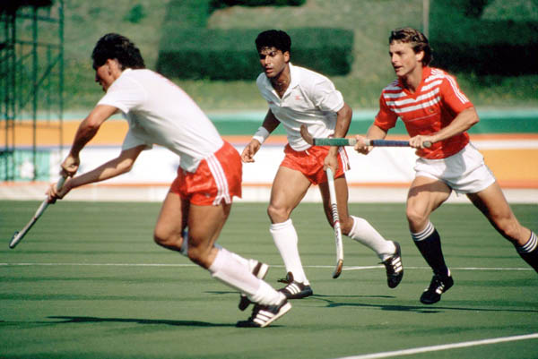 Canada's Ross Rutledge (left) and Satinder Chohan (centre)  play field hockey at the 1984 Los Angeles Olympic Games. (CP Photo/ COA/ Ted Grant)