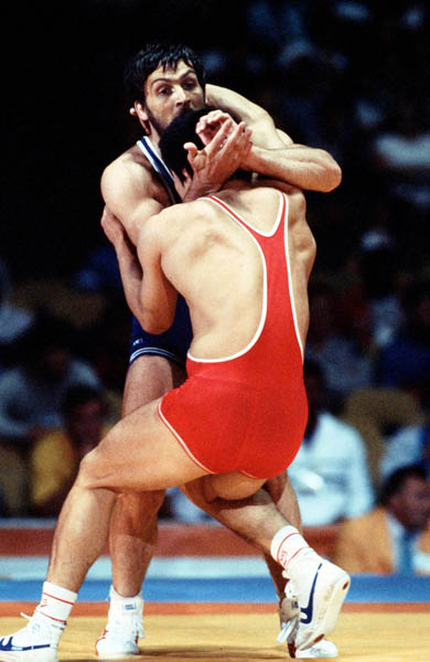 Canada's Louis Santerre (blue) competes in the Greco Roman wrestling event at the 1984 Olympic games in Los Angeles. (CP PHOTO/COA/Crombie McNeil)