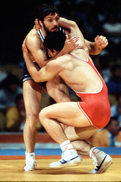 Canada's Louis Santerre (blue) competes in the Greco Roman wrestling event at the 1984 Olympic games in Los Angeles. (CP PHOTO/COA/Crombie McNeil)