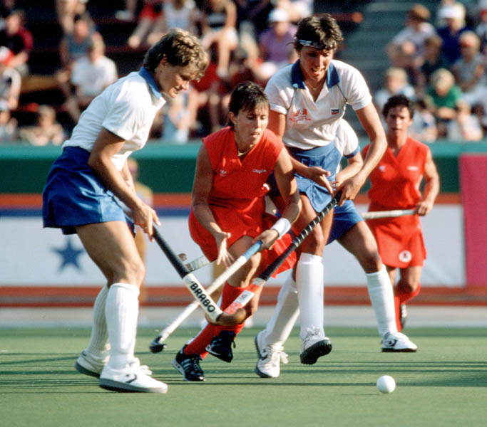 Canada's Darlene Stoyka (centre) and Shelia Forshaw (right) play field hockey at the 1984 Los Angeles Olympic Games. (CP Photo/ COA/ Ted Grant)