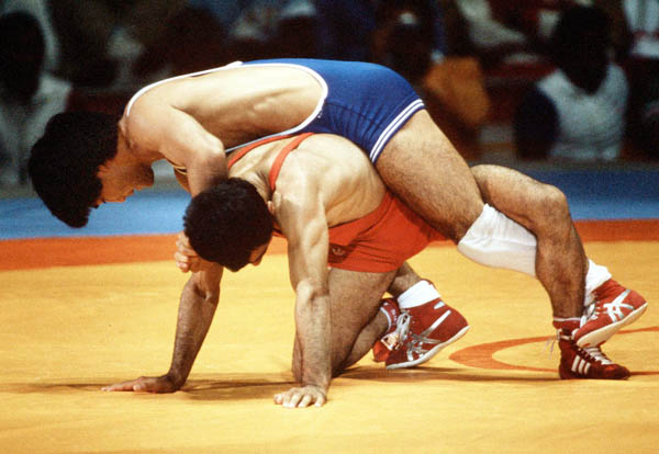 Canada's Ray Takahashi (blue) competes in the freestyle wrestling event at the 1984 Olympic games in Los Angeles. (CP PHOTO/COA/Crombie McNeil)