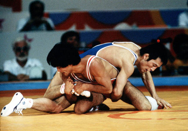 Canada's Ray Takahashi (red) competes in the freestyle wrestling event at the 1984 Olympic games in Los Angeles. (CP PHOTO/COA/Crombie McNeil)