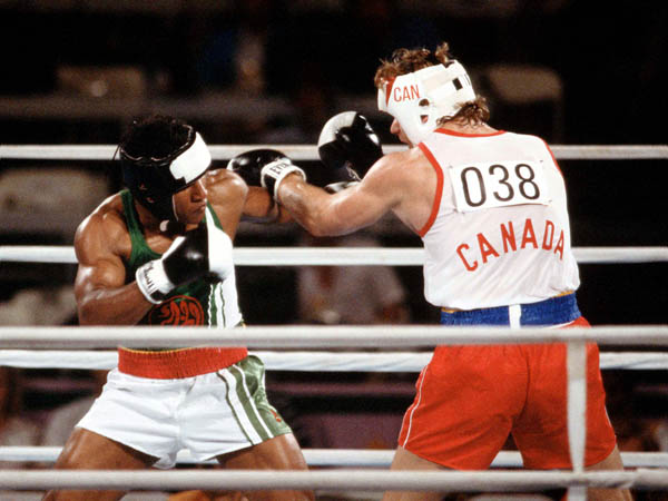 Canada's Willie Dewit (right) competes in the boxing event at the 1984 Olympic games in Los Angeles. (CP PHOTO/ COA/ Tim O'lett)