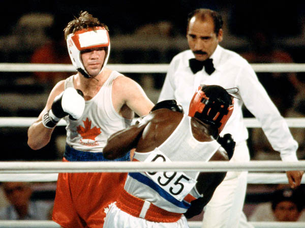 Canada's Shawn O'Sullivan (left) competes in the boxing event at the 1984 Olympic games in Los Angeles. (CP PHOTO/ COA/ Tim O'lett)