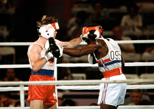 Canada's Shawn O'Sullivan (left) competing in the boxing event at the 1984 Olympic games in Los Angeles. (CP PHOTO/ COA/ Tim O'lett)