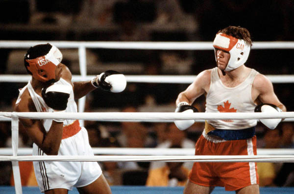 Canada's Shawn O'Sullivan (right) competes in the boxing event at the 1984 Olympic games in Los Angeles. (CP PHOTO/ COA/ Tim O'lett)