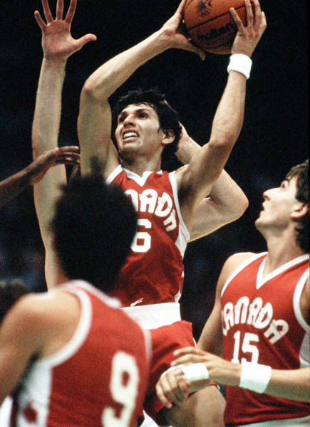 Canada's Eli Pasquale (6), Dan Measher (15) and Jay Triano (9) play basketball at the 1984 Olympic Games in Los Angeles. (CP PHOTO/COA/J. Merrithew)