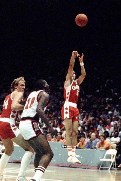 Canada's Eli Pasquale (6) throws for a basket during basketball action at the 1984 Olympic Games in Los Angeles. (CP PHOTO/COA/J. Merrithew)