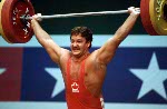 Canada's Akos Sandor of Mississauga, Ont. during his lift in the men's 105 kg weightlifting competition at the Olympic Games in Athens, Tuesday, August 24, 2004. (CP PHOTO/COC-Mike Ridewood)