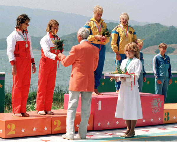 Canada's Alexandra Barre (left) and Sue Holloway (second from left) celebrate a silver medal win in the women's 2x kayak event at the 1984 Olympic games in Los Angeles. (CP PHOTO/ COA/)
