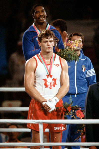 Canada's Willie Dewit (front) celebrates a silver medal win in the boxing event at the 1984 Olympic games in Los Angeles. (CP PHOTO/ COA/Tim O'lett)