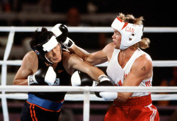 Canada's Rick Duff (right) competes in the boxing event at the 1984 Olympic games in Los Angeles. (CP PHOTO/ COA/ Tim O'lett)