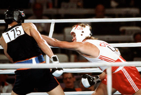 Canada's Rick Duff (right) competes in the boxing event at the 1984 Olympic games in Los Angeles. (CP PHOTO/ COA/ Tim O'lett)