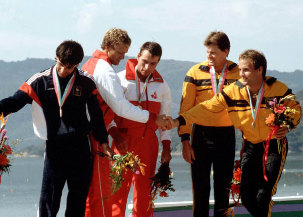 (Centre) Canada's Hugh Fisher and Alwyn Morris celebrate a gold medal win in the men's kayak K-2 event at the 1984 Olympic games in Los Angeles. (CP PHOTO/ COA/)