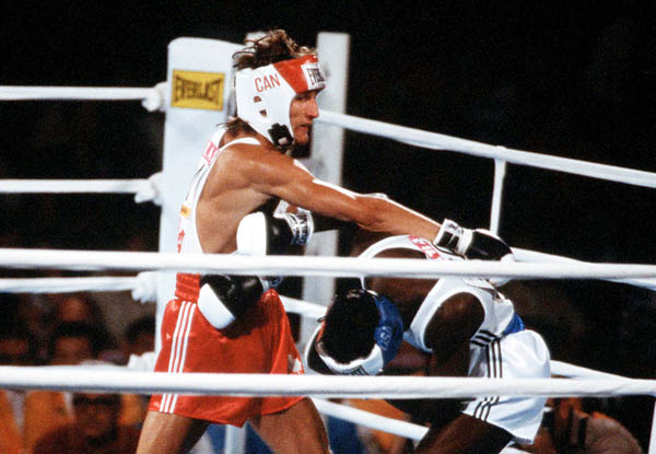 Canada's Wayne Gordon (left) competes in the boxing event at the 1984 Olympic games in Los Angeles. (CP PHOTO/ COA/ Tim O'lett)