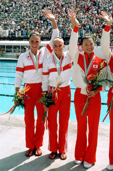 Canada's Kelly Kryczka (left) and Sharon Hambrook celebrate a silver medal win in the synchronized swimming event at the 1984 Olympic games in Los Angeles. (CP PHOTO/ COA/Tim O'lett)
