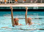 Canada's Sharon Hambrook (right) and Kelly Kryczka perform their synchronized swimming routine at the 1984 Loas Angeles Olympic Games. (CP Photo/ COA/ Tim O'lett)