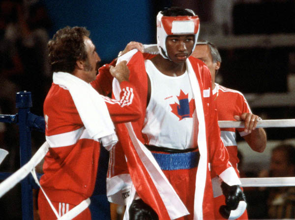 Canada's Lennox Lewis competes in the boxing event at the 1984 Olympic games in Los Angeles. (CP PHOTO/ COA/ Tim O'lett)