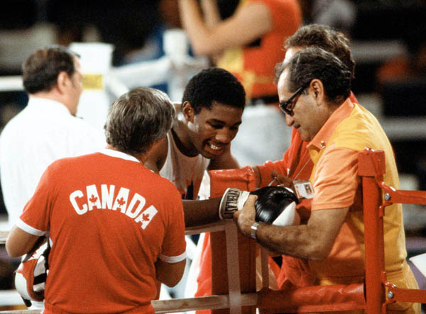 Canada's Lennox Lewis (centre) competes in the boxing event at the 1984 Olympic games in Los Angeles. (CP PHOTO/ COA/ Tim O'lett)