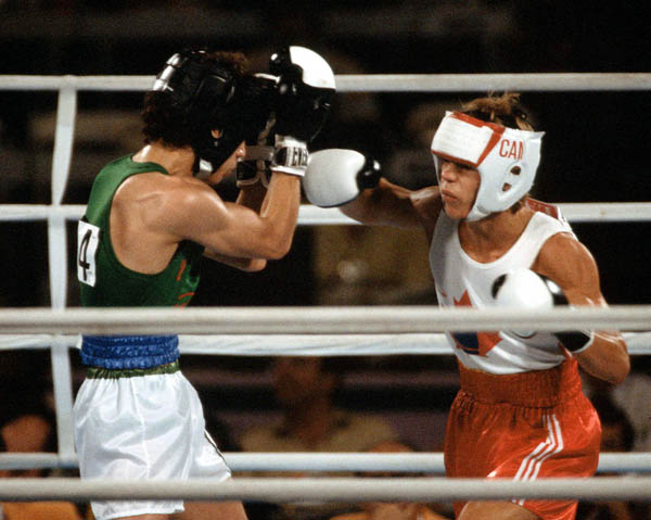 Canada's Dale Walters (right) competes in the boxing event at the 1984 Olympic games in Los Angeles. (CP PHOTO/ COA/ Tim O'lett)