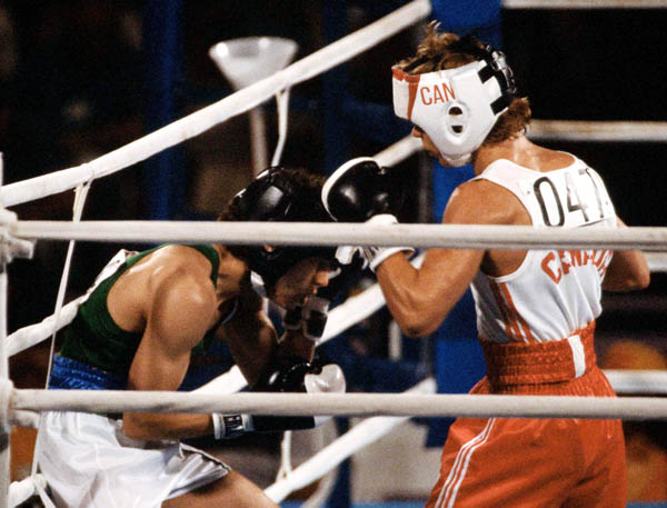 Canada's Dale Walters (right) competes in the boxing event at the 1984 Olympic games in Los Angeles. (CP PHOTO/ COA/ Tim O'lett)
