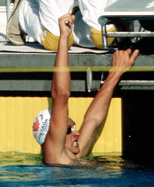 Canada's Alex Baumann celebrates as he looks at his time in the swimming event at the 1984 Olympic games in Los Angeles. (CP PHOTO/ COA/Ted Grant )