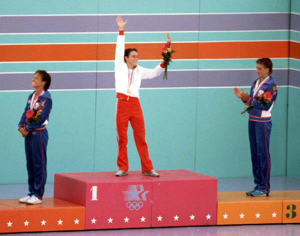Canada's Sylvie Bernier (centre) celebrates a gold medal win in the women's diving event at the 1984 Olympic games in Los Angeles. (CP PHOTO/ COA/Ted Grant)