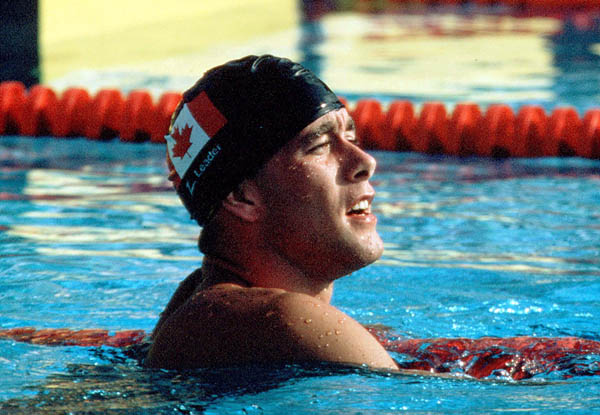 Canada's Victor Davis looks up his time in the swimming event at the 1984 Olympic games in Los Angeles. (CP PHOTO/ COA/Ted Grant )
