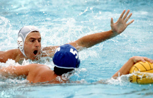 Canada's Bill Meyer (white) competes in the men's water polo event at the 1984 Olympic Games Los Angeles. (CP Photo/COA/Tim O'lett)