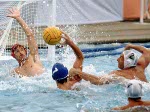 Canada's Rick Zayonc (goalie) and Alex Juhasz (2) compete in men's water polo action at the 1984 Olympic Games Los Angeles. (CP Photo/COA/Tim O'lett)