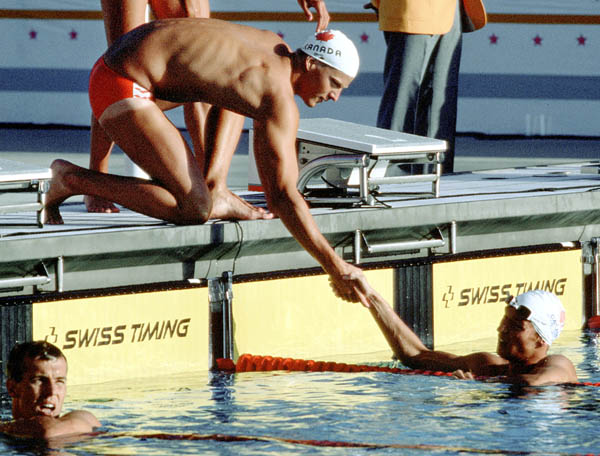 Canada's Sangy Goss (left) and Alex Baumann compete in the swimming event at the 1984 Olympic games in Los Angeles. (CP PHOTO/ COA/Ted Grant )