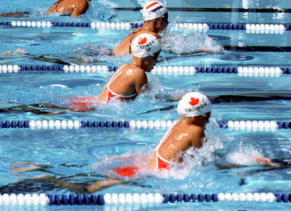 Canada's Mary Lubawski (centre) and Anne Ottenbrite (front) competes in the swimming event at the 1984 Olympic games in Los Angeles. (CP PHOTO/ COA/Ted Grant )