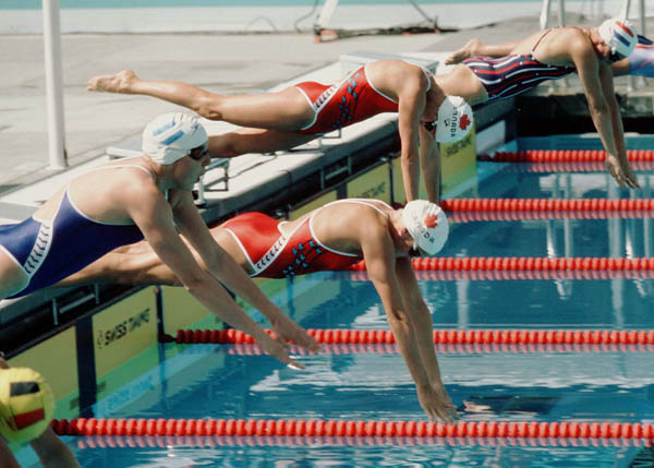 Canada's Mary Lubawski (second) and Anne Ottenbrite (third) compete in the swimming event at the 1984 Olympic games in Los Angeles. (CP PHOTO/ COA/Ted Grant )