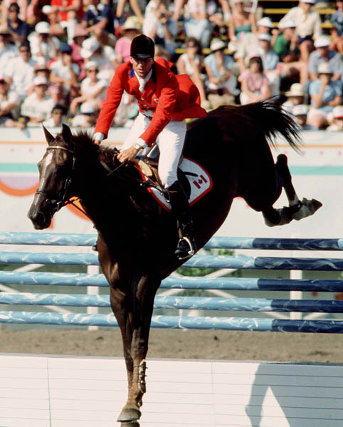 Canada's Ian Millar rides Warrior in the equestrian event at the 1984 Olympic games in Los Angeles. (CP PHOTO/ COA/Tim O'lett)