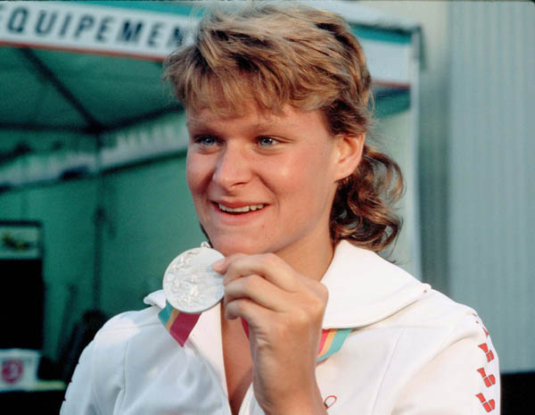 Canada's Anne Ottenbrite holds up her silver medal won in the swimming event at the 1984 Olympic games in Los Angeles. (CP PHOTO/ COA/)