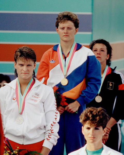 Canada's Anne Ottenbrite (left) celebrates a silver medal win in a swimming event at the 1984 Olympic games in Los Angeles. (CP PHOTO/ COA/)