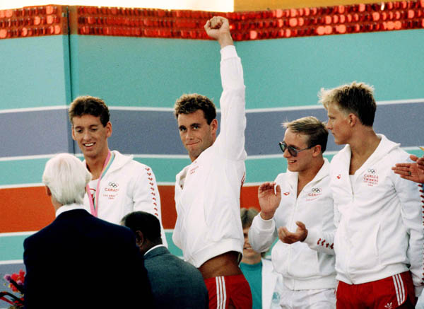 Canada's men's relay team (from left to right) Mike West, Victor Davis, Tom Ponting and Sandy Goss celebrate their silver medal win in the swimming event at the 1984 Olympic games in Los Angeles. (CP PHOTO/ COA/Jim Merrithew)
