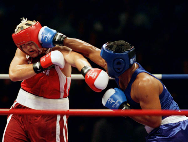 Canada's Artur Binkowski (left) participates in a boxing match at the 2000 Sydney Olympic Games. (CP Photo/ COA)