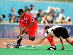 Canada's Alan Brahmst (4) and Rob Short (13) play field hockey at the 2000 Sydney Olympic Games. (CP Photo/ COA)