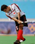 Canada's Andrew Griffiths (8) plays field hockey at the 2000 Sydney Olympic Games. (CP Photo/ COA)