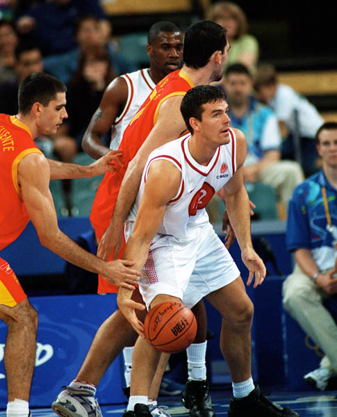 Canada's Eric Hinrichsen (right) participates in basketball action at the 2000 Sydney Olympic Games. (CP Photo/ COA)