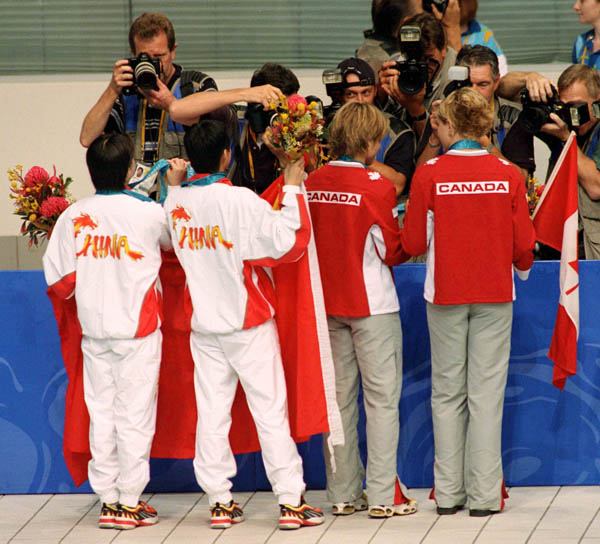 Canada's diving team (right), Emilie Heymans and Anne Montminy,, celebrates their silver medal win in the synchronized diving event at the 2000 Sydney Olympic games. (CP PHOTO/ COA)
