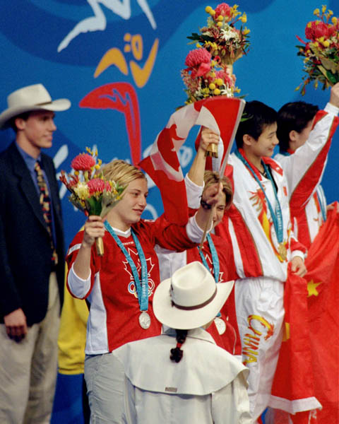 Canada's diving team, Emilie Heymans (left) and Anne Montminy, celebrates their silver medal win in the synchronized diving event at the 2000 Sydney Olympic games. (CP PHOTO/ COA)