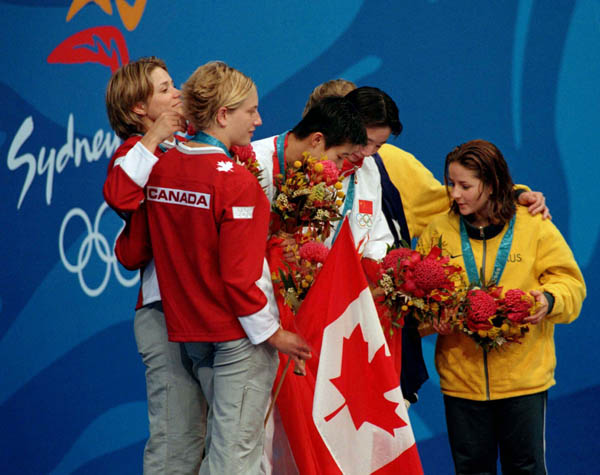 Canada's diving team (left), Emilie Heymans and Anne Montminy, celebrates their silver medal win in the synchronized diving event at the 2000 Sydney Olympic games. (CP PHOTO/ COA)