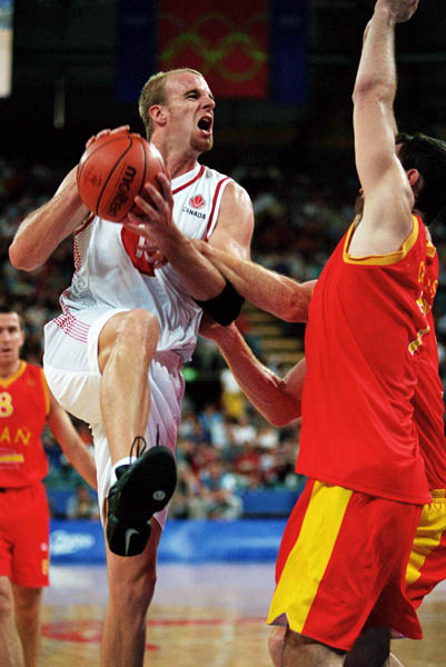 Canada's Greg Newton participates in basketball action at the 2000 Sydney Olympic Games. (CP Photo/ COA)