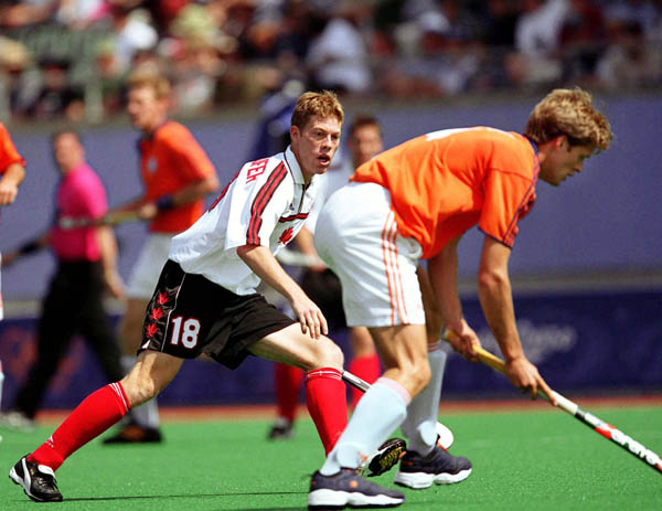 Canada's Paul Wettlaufer (left) competes in field hockey action at the 2000 Sydney Olympic Games. (CP Photo/ COA)