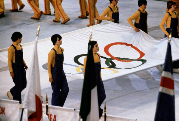 The Olympic flag is carried during closing ceremonies at the 1980 Winter Olympics in Lake Placid. (CP Photo/COA)