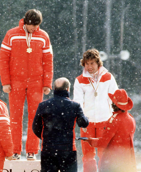 Steve Podborski (white) celebrates his bronze medal win in the alpine ski event at the 1980 Lake Placid Olympic winter Games. (CP PHOTO/COA)