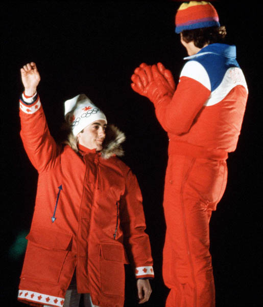 Canada's Gaetan Boucher (left) celebrates his silver medal win in the speed skating event at the 1980 Lake Placid Olympic winter Games. (CP Photo/COA)